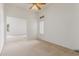 This is a carpeted bedroom featuring a window and neutral colors throughout at 11010 W Palm Ln, Avondale, AZ 85392