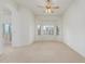 Bright carpeted bedroom featuring a bay window with stylish shutters at 11010 W Palm Ln, Avondale, AZ 85392