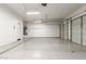 Spacious three-car garage with epoxy flooring, offering ample parking and storage, plus a water heater at 11010 W Palm Ln, Avondale, AZ 85392