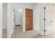 Hallway featuring a closet and access to other rooms, providing seamless transitions and storage solutions at 11010 W Palm Ln, Avondale, AZ 85392