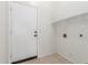 A dedicated laundry area features ample space, a door, and shelf, providing convenience for household chores at 11010 W Palm Ln, Avondale, AZ 85392