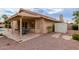 Charming home featuring a cozy covered patio with stone flooring and a quaint outdoor dining set at 1139 E Stephens Dr, Tempe, AZ 85283