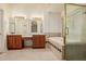 Bathroom features a vanity with granite countertops, dual sinks and vanity area, with separate tub and glass shower at 1139 E Stephens Dr, Tempe, AZ 85283