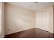 Bedroom features beautiful wood floors and a closet with white doors at 1139 E Stephens Dr, Tempe, AZ 85283