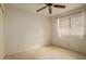 Bright bedroom with a ceiling fan and window offering natural light at 1139 E Stephens Dr, Tempe, AZ 85283