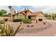 View of a single-story home with desert landscaping and a three car garage at 1139 E Stephens Dr, Tempe, AZ 85283