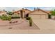 Single-story home featuring a three-car garage, low maintenance desert landscaping, and a red tile roof at 1139 E Stephens Dr, Tempe, AZ 85283