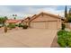A single-story house with a three-car garage and desert landscaping, including cacti and rocks at 1139 E Stephens Dr, Tempe, AZ 85283