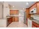This kitchen has granite counters, stainless appliances, and a view to the living room at 1139 E Stephens Dr, Tempe, AZ 85283
