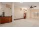 Open-concept living room with a wet bar and a front door entrance at 1139 E Stephens Dr, Tempe, AZ 85283