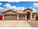 Charming single-story home features a three-car garage and manicured landscaping at 1144 W Tremaine Ave, Gilbert, AZ 85233