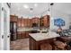 Modern kitchen features a center island and stainless steel appliances at 1144 W Tremaine Ave, Gilbert, AZ 85233