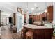 Bright kitchen boasts an island with seating and a convenient pantry at 1144 W Tremaine Ave, Gilbert, AZ 85233