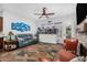 Relaxing living space with comfortable seating and a large aquarium at 1144 W Tremaine Ave, Gilbert, AZ 85233