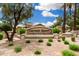 Community sign at Cayman Square featuring manicured landscaping and desert gravel at 1144 W Tremaine Ave, Gilbert, AZ 85233