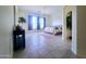 Spacious bedroom with tile floors, neutral walls, and a comfortable queen-sized bed at 1210 E Westchester Dr, Chandler, AZ 85249