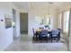 Bright dining room featuring a dining table with six chairs and a large window with neutral decor at 1210 E Westchester Dr, Chandler, AZ 85249