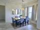 Bright dining room featuring a dining table with six chairs and a large window with neutral decor at 1210 E Westchester Dr, Chandler, AZ 85249