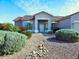 Inviting single-story home with desert landscaping, neutral tones and a welcoming entrance at 1210 E Westchester Dr, Chandler, AZ 85249