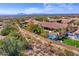 Aerial view showcases the backyard oasis with pool and spa surrounded by mountain views at 12225 E Cortez Dr, Scottsdale, AZ 85259
