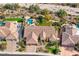 Aerial view showcasing the backyard oasis with pool, spa, and lush landscaping at 12225 E Cortez Dr, Scottsdale, AZ 85259