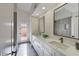 Contemporary bathroom with dual sinks, marble countertops, and modern fixtures at 12225 E Cortez Dr, Scottsdale, AZ 85259