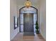 Welcoming entryway featuring front door with decorative glass and tile flooring at 12225 E Cortez Dr, Scottsdale, AZ 85259