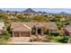 Stunning single-story home featuring a stone driveway, two-car garage, and a tile roof at 12225 E Cortez Dr, Scottsdale, AZ 85259