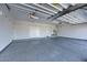 Spacious garage with epoxy floors, overhead lighting and ample storage space at 12225 E Cortez Dr, Scottsdale, AZ 85259