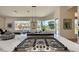 Gourmet kitchen featuring a large island with a cooktop and views of the landscaped backyard at 12225 E Cortez Dr, Scottsdale, AZ 85259