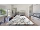 Large kitchen island featuring a marble countertop, cooktop, and bar seating at 12225 E Cortez Dr, Scottsdale, AZ 85259