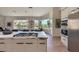 Kitchen with a central island cooktop and a view of the outdoor landscape at 12225 E Cortez Dr, Scottsdale, AZ 85259