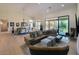 Spacious living room featuring a large sectional sofa and an open floor plan at 12225 E Cortez Dr, Scottsdale, AZ 85259