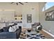 Comfortable living room with modern decor adjacent to the open concept kitchen and dining areas at 12225 E Cortez Dr, Scottsdale, AZ 85259
