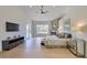 Bright and spacious main bedroom with a fireplace, ceiling fan, and outdoor view at 12225 E Cortez Dr, Scottsdale, AZ 85259