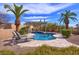 Pool area offers desert landscaping with lounge chairs, covered patio, and blue skies at 12225 E Cortez Dr, Scottsdale, AZ 85259