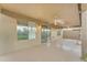 Relaxing covered back patio with ceiling fans leading to outdoor living spaces at 14010 N 126Th Ave, El Mirage, AZ 85335