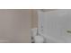 Clean bathroom features a tiled shower and tub combination next to a toilet at 14010 N 126Th Ave, El Mirage, AZ 85335