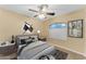 Bedroom with stylish decor, carpet and a window that allows natural light to fill the space at 14010 N 126Th Ave, El Mirage, AZ 85335