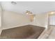 Spacious living room featuring hardwood floors and staircase access at 14010 N 126Th Ave, El Mirage, AZ 85335