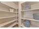 Pantry with numerous shelves to store items, enhancing organization and accessibility at 14010 N 126Th Ave, El Mirage, AZ 85335