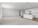 Bright, open living area with neutral carpet, recessed lighting, and connected kitchen at 1409 E Jacqueline Pl, Casa Grande, AZ 85122