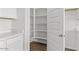 Walk-in pantry with built-in shelving next to the kitchen for organized storage at 1409 E Jacqueline Pl, Casa Grande, AZ 85122