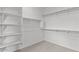 Walk-in closet featuring multiple shelves and clothes rods for organization at 1409 E Jacqueline Pl, Casa Grande, AZ 85122