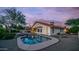 Private backyard with a refreshing pool, spa, mature shade trees, and a well-maintained gravel area at 14248 N 56Th Pl, Scottsdale, AZ 85254