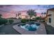 Beautiful backyard featuring a private pool, spa, mature trees, and a block fence for added privacy at 14248 N 56Th Pl, Scottsdale, AZ 85254