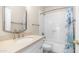 Bright bathroom with white vanity, sink, subway tile, and shower-tub combo at 14248 N 56Th Pl, Scottsdale, AZ 85254