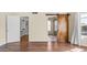 Bedroom featuring hardwood floors and doorways to the bathroom and walk-in closet at 14248 N 56Th Pl, Scottsdale, AZ 85254