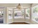 Cozy dining area with bay window, blinds, and views of the landscaped backyard at 14248 N 56Th Pl, Scottsdale, AZ 85254