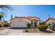 Charming single-story home with a well-maintained lawn, mature landscaping, and a two-car garage under a clear, sunny sky at 14248 N 56Th Pl, Scottsdale, AZ 85254